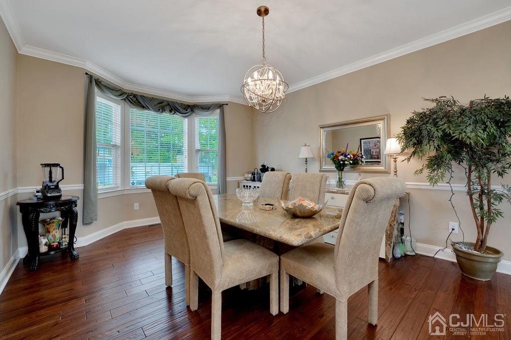 339 Ticetown Road Old Bridge, NJ 08857 - Photo 10 of 44 a view of a dining room with furniture window and wooden floor