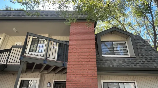 a backyard of a house with yard and outdoor seating