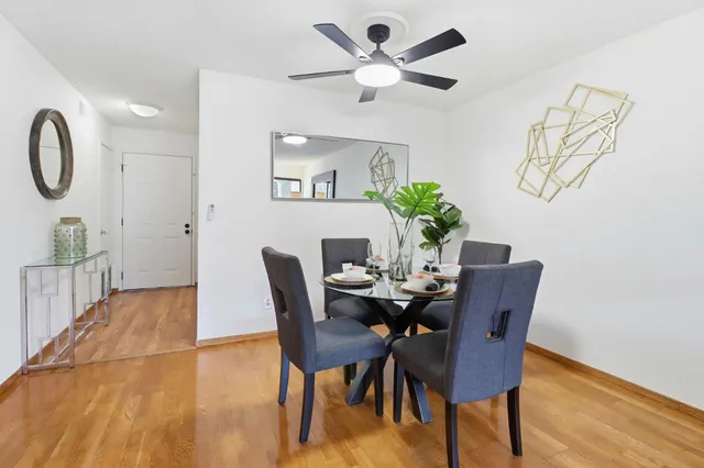 a kitchen with stainless steel appliances granite countertop a sink a window and cabinets