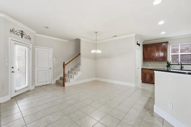 a view of a kitchen with a sink and cabinets