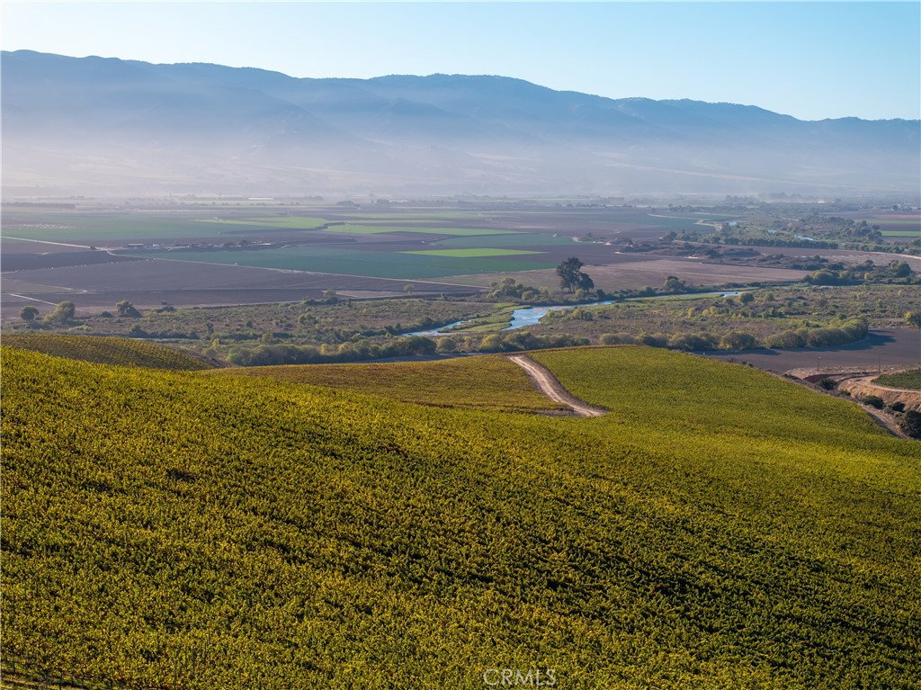 a view of an ocean and a mountain