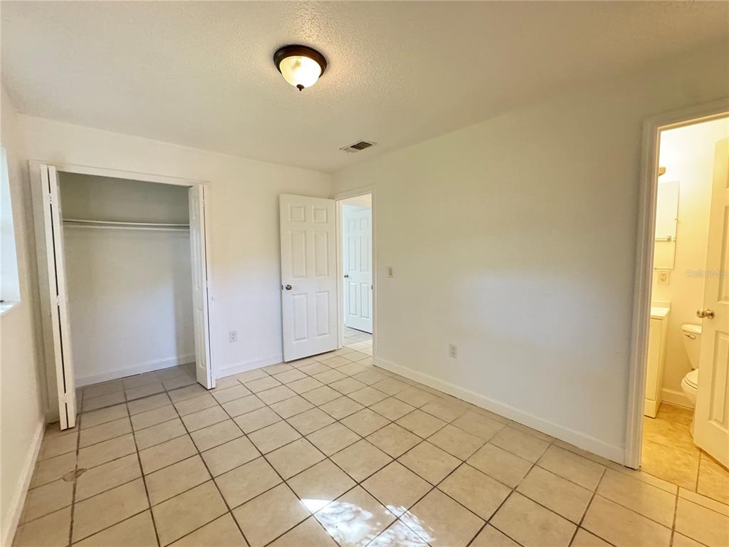 4883 North Pine Hills Road, Unit 4881 Orlando, FL 32808 - Photo 13 of 16 a view of an empty room and window