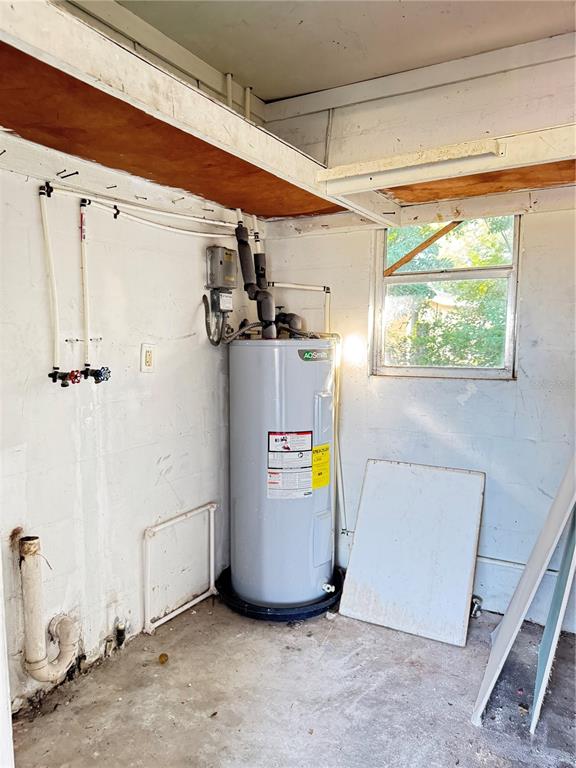 4883 North Pine Hills Road, Unit 4881 Orlando, FL 32808 - Photo 16 of 16 a view of a storage & utility room with a window