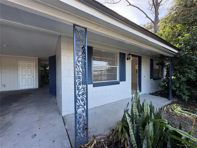 a potted plant in front of a house
