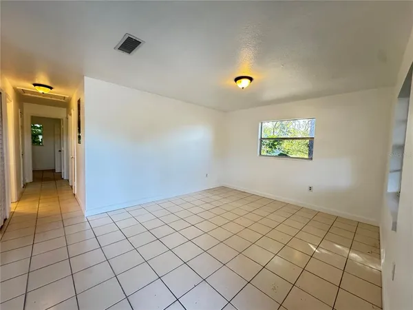 a view of an empty room and window