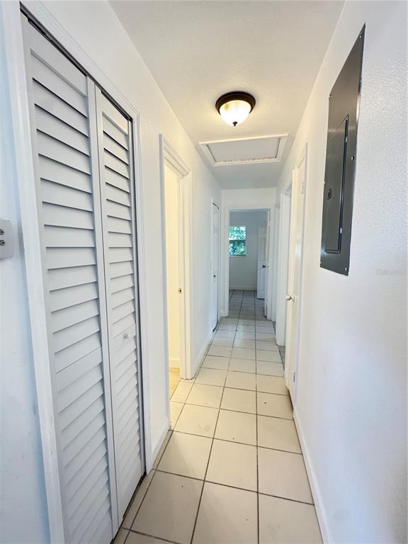 4883 North Pine Hills Road, Unit 4881 Orlando, FL 32808 - Photo 6 of 16 a view of a hallway