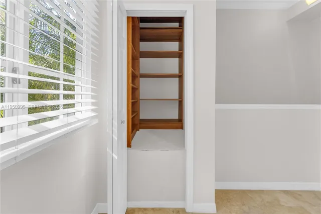 a view of room with stairs and a window