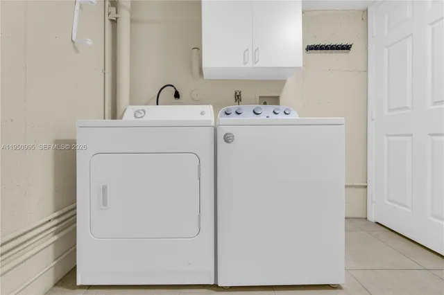a utility room with washer and dryer
