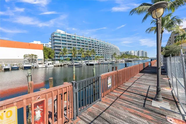 an aerial view of a house with garden space and street view