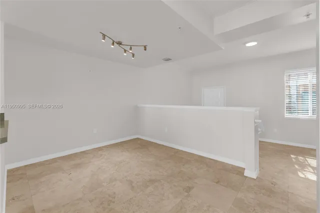 a view of a kitchen with a sink and cabinet area