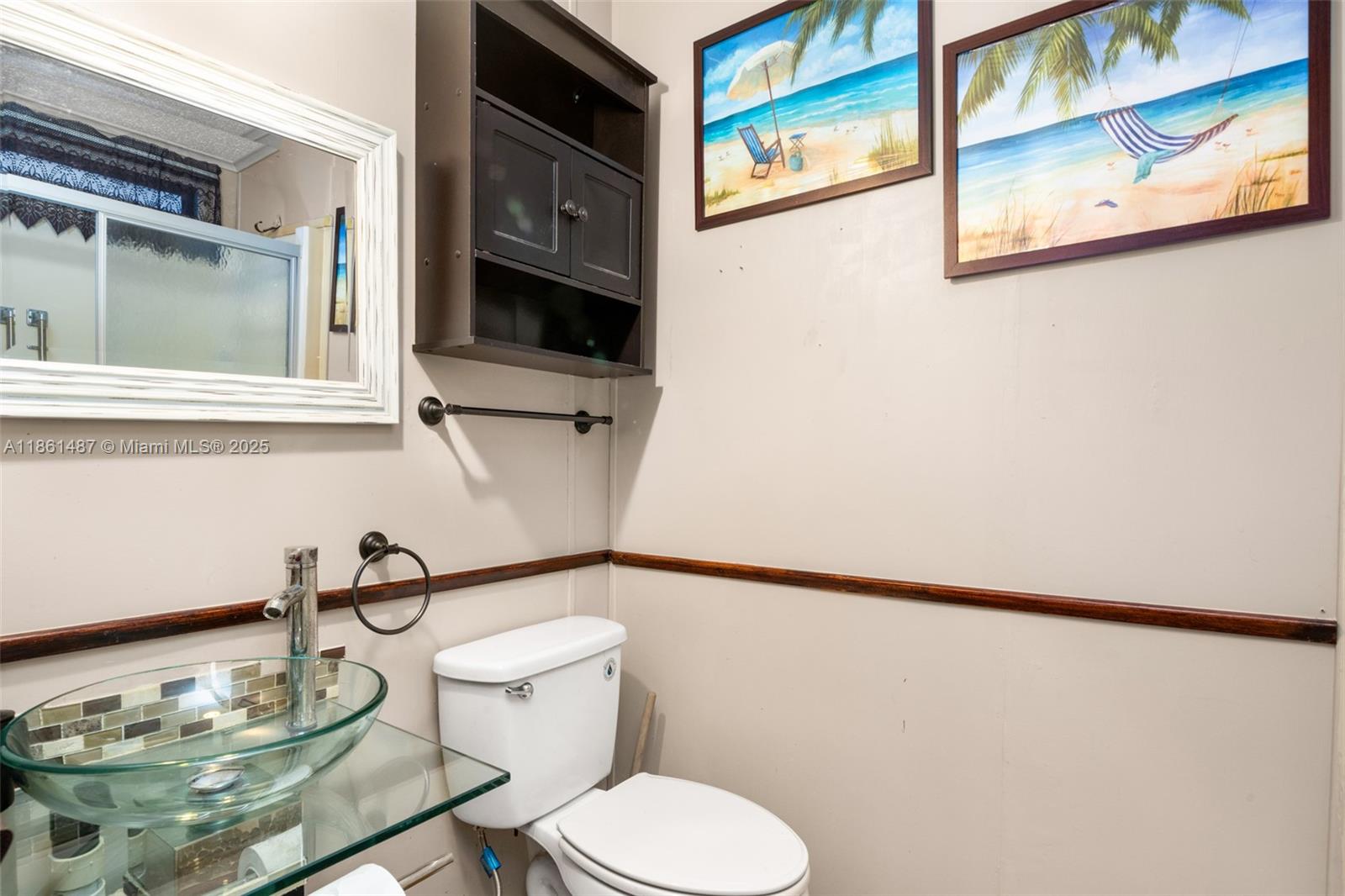 1145 Bluejay Road Wauchula, FL 33873 - Photo 15 of 42 a bathroom with a sink and a mirror