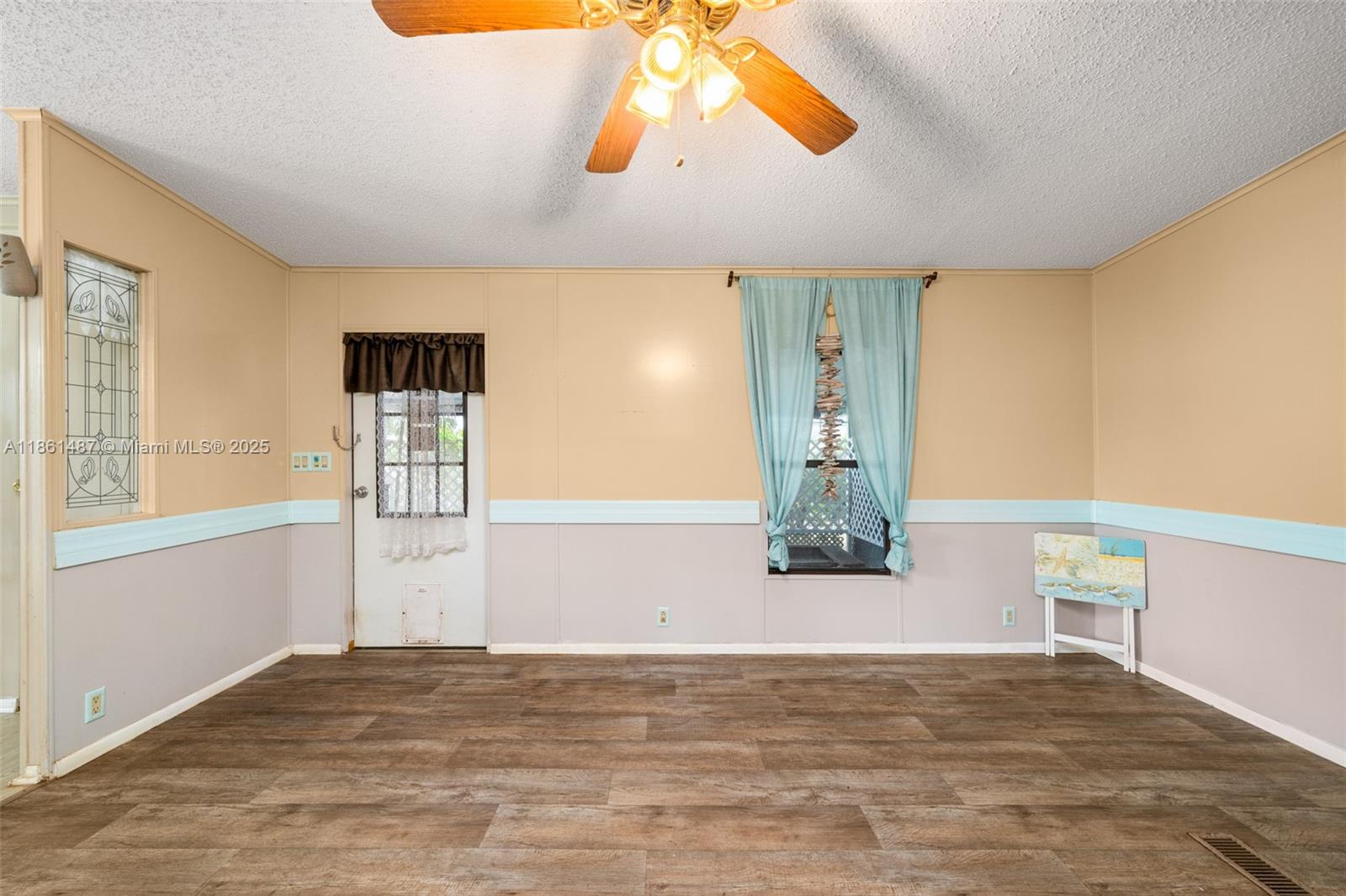 1145 Bluejay Road Wauchula, FL 33873 - Photo 5 of 42 a view of a room with wooden floor and window