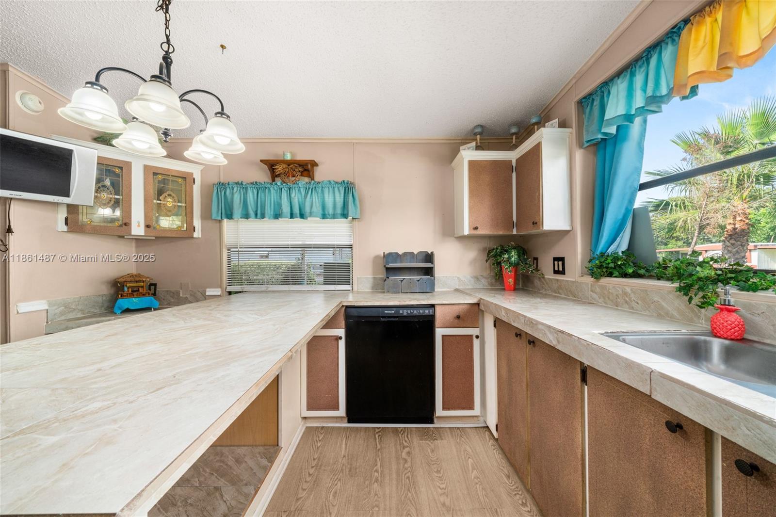 1145 Bluejay Road Wauchula, FL 33873 - Photo 9 of 42 a kitchen with a sink cabinets and window