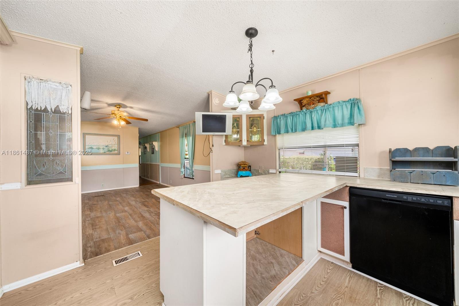 1145 Bluejay Road Wauchula, FL 33873 - Photo 10 of 42 a kitchen with a sink a counter top space and stainless steel appliances