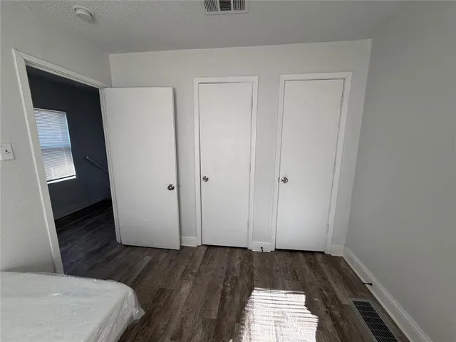a view of hallway with wooden floor