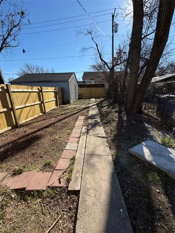 a view of a backyard of the house