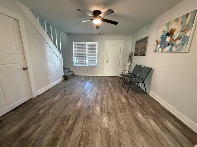 a view of room with furniture wooden floor and window