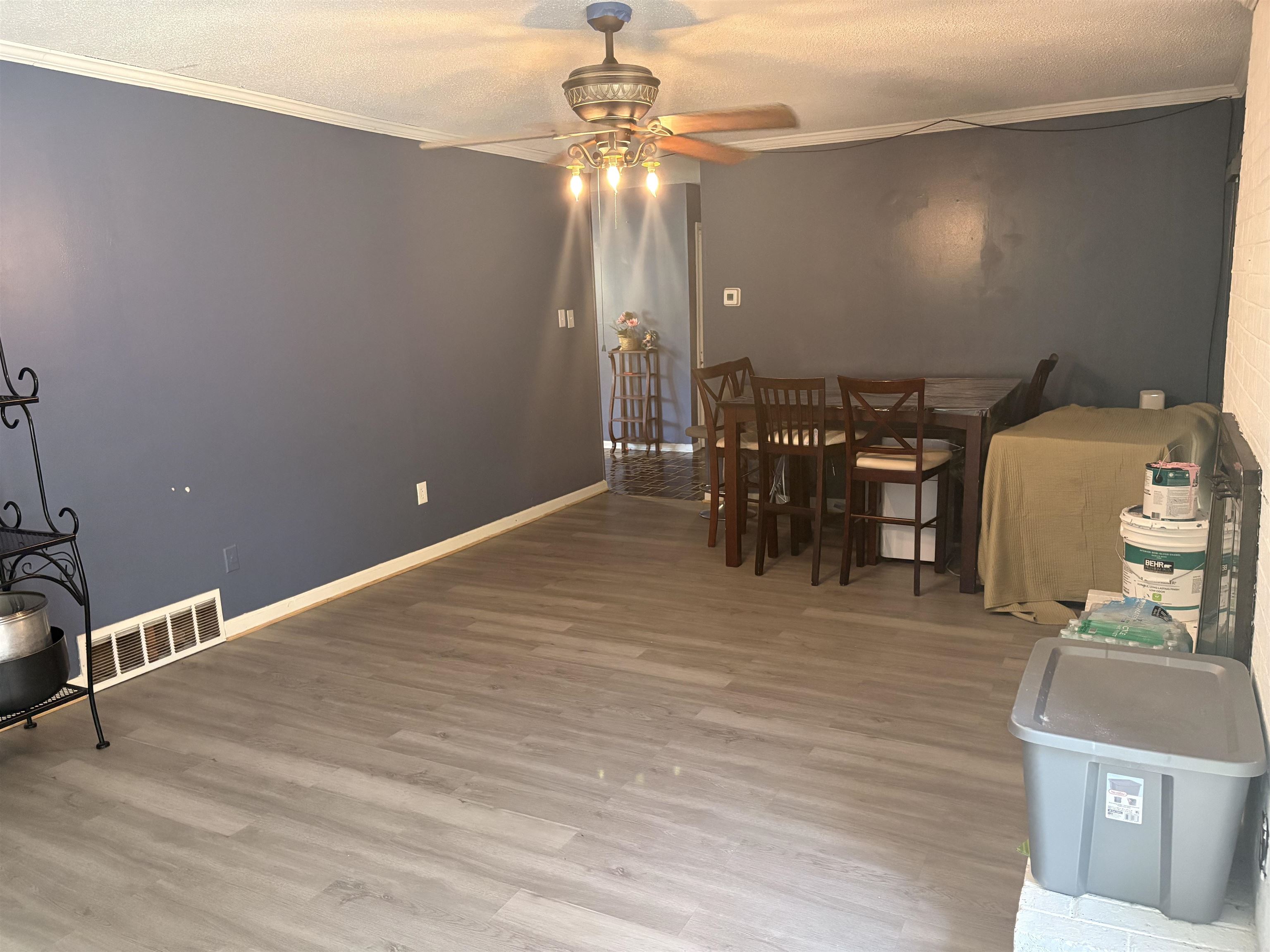 4009 Tessland Road Memphis, TN 38128 - Photo 16 of 16 Spacious room featuring wood-finish flooring, crown molding, and a ceiling fan with integrated lighting