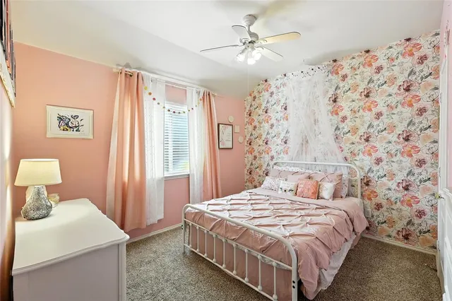 a bedroom with a bed and a table