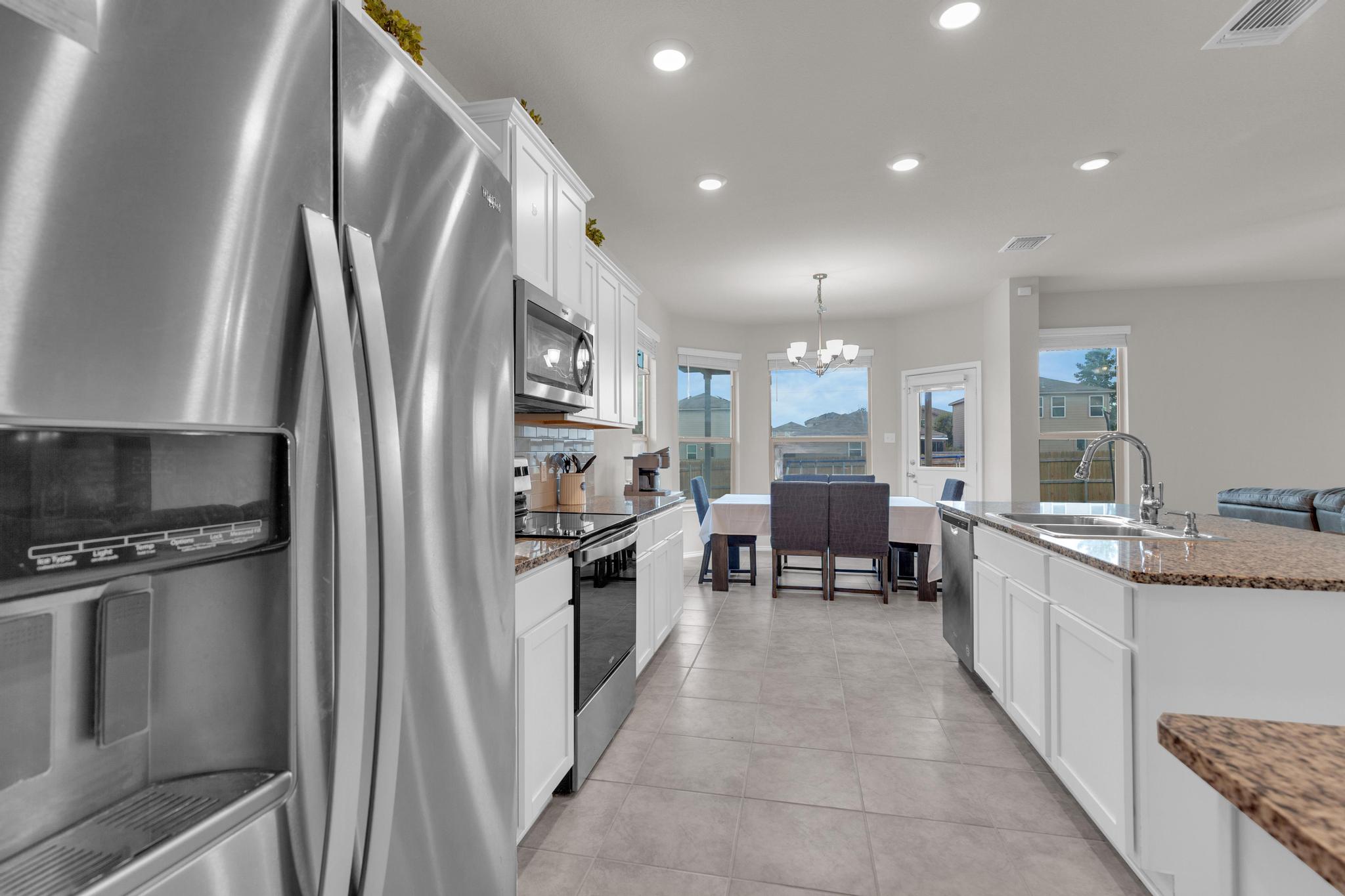 104 Uncle Billy Way Jarrell, TX 76537 - Photo 20 of 38 A well-appointed kitchen showcasing modern stainless steel appliances and abundant counter space.