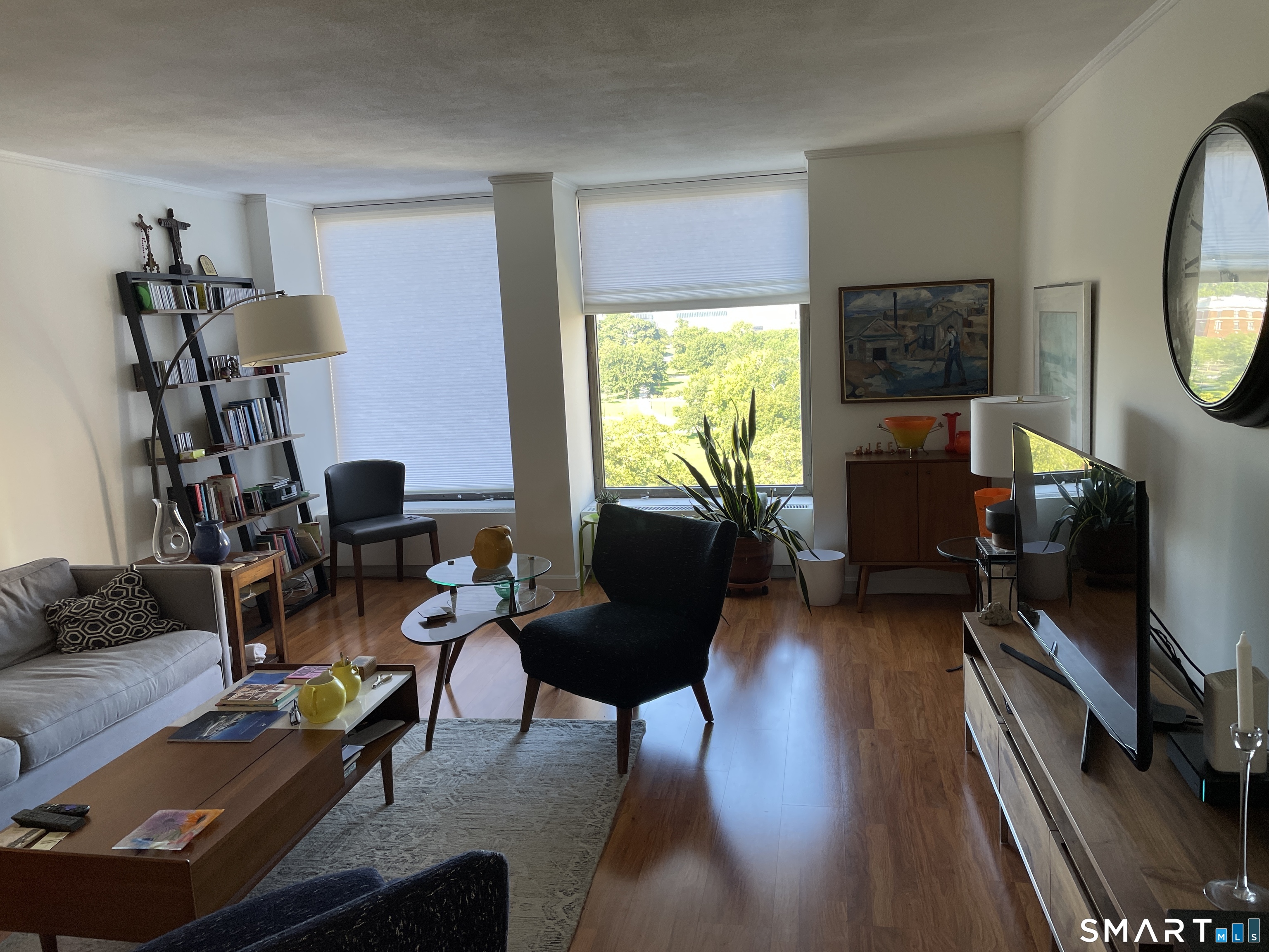 1 Gold Street, Unit 9C Hartford, CT 06103 - Photo 16 of 16 a living room with furniture a window and a flat screen tv
