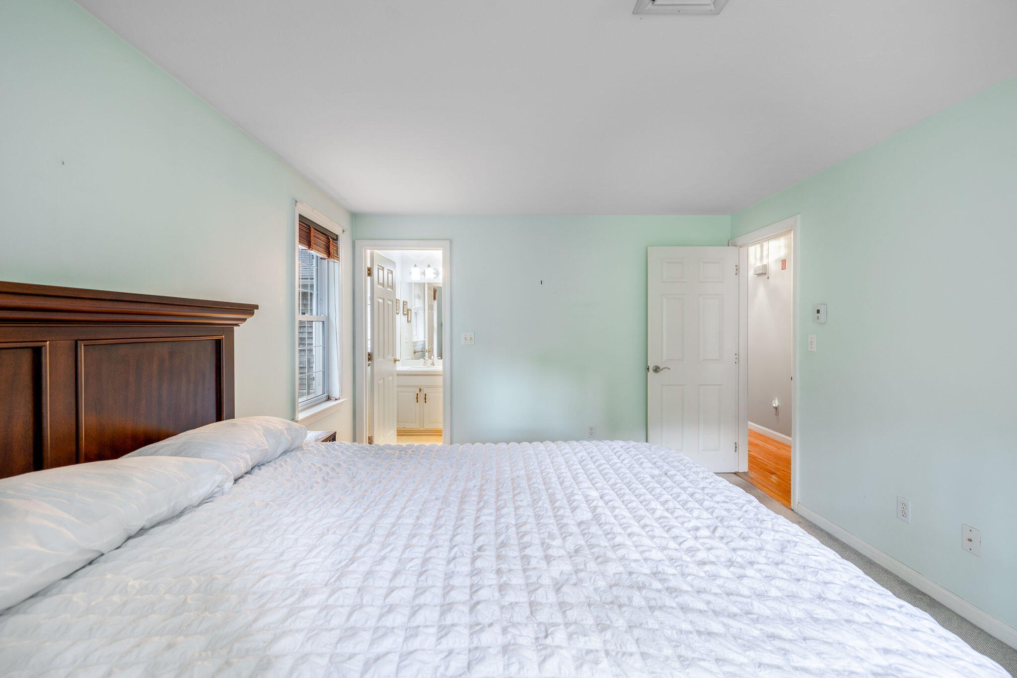 66 Chuckles Way Marstons Mills, MA 02648 - Photo 21 of 32 a bedroom with a large bed and dresser