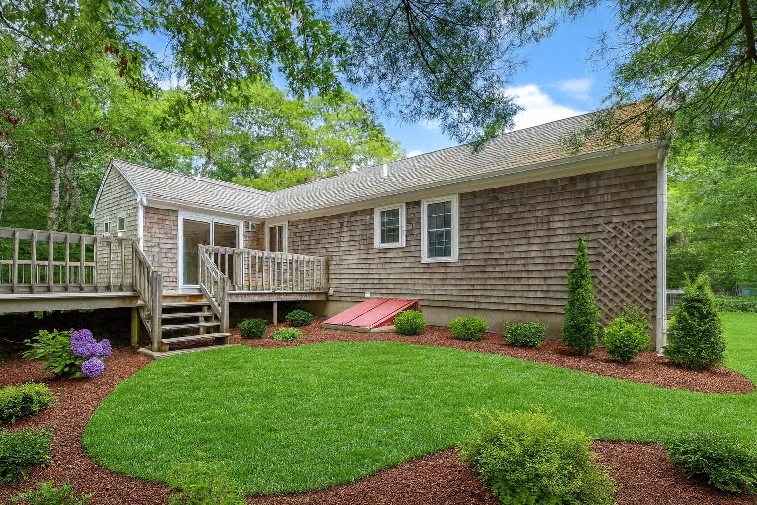66 Chuckles Way Marstons Mills, MA 02648 - Photo 26 of 32 a front view of house with yard