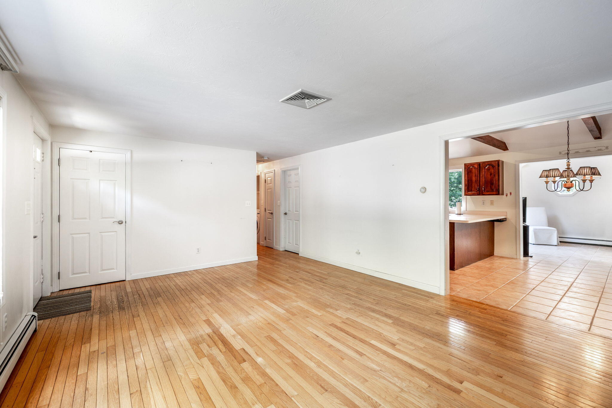 66 Chuckles Way Marstons Mills, MA 02648 - Photo 4 of 32 a view of a kitchen with wooden floor