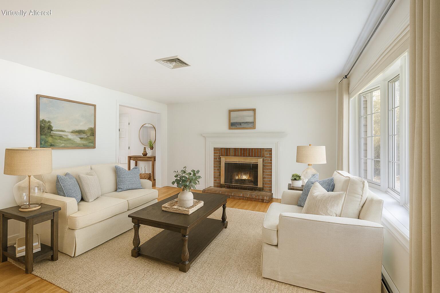 66 Chuckles Way Marstons Mills, MA 02648 - Photo 5 of 32 a living room with furniture and a fireplace