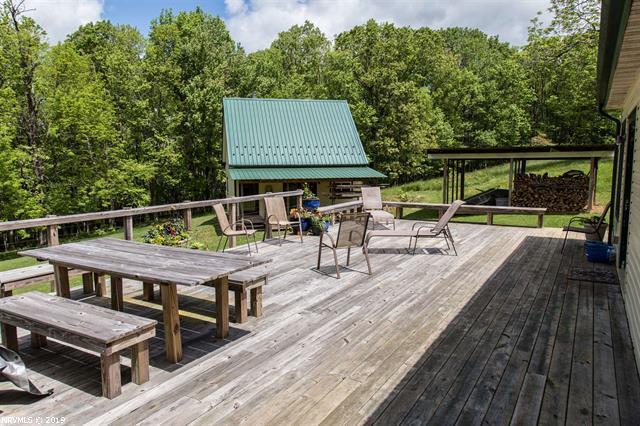 2094 Union School Road Southwest Willis, VA 24380 - Photo 15 of 40 an outdoor space with furniture and umbrella