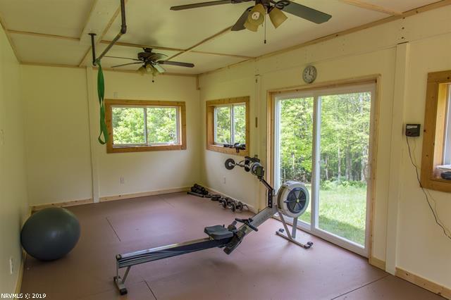 2094 Union School Road Southwest Willis, VA 24380 - Photo 21 of 40 a room with gym equipment and windows