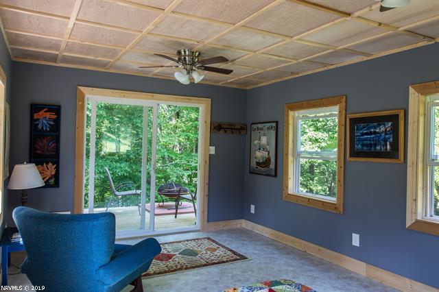 2094 Union School Road Southwest Willis, VA 24380 - Photo 26 of 40 a living room with furniture and a large window