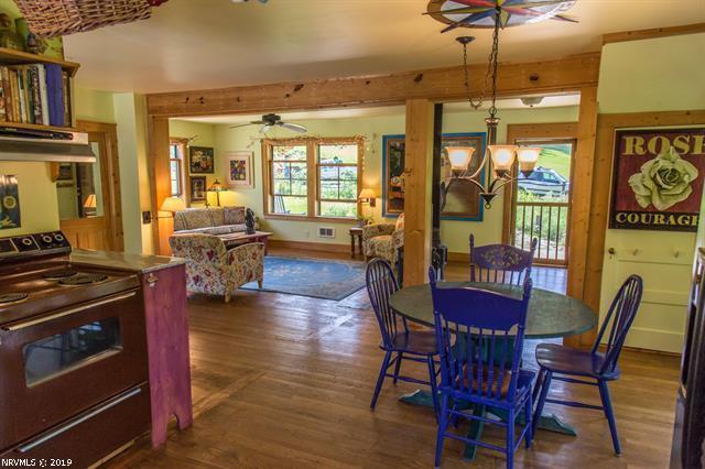2094 Union School Road Southwest Willis, VA 24380 - Photo 4 of 40 a view of a dining room with furniture window and wooden floor