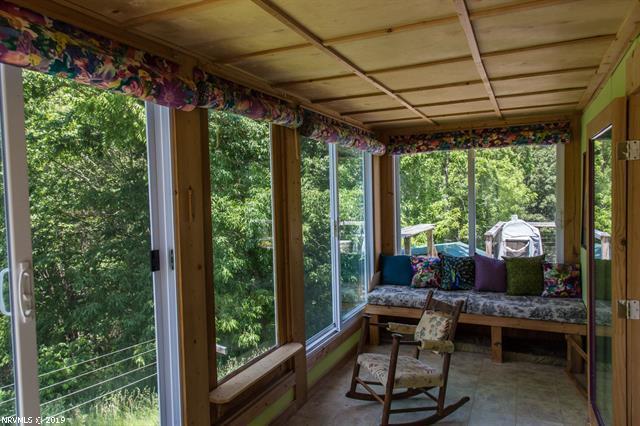 2094 Union School Road Southwest Willis, VA 24380 - Photo 5 of 40 a view of a porch with furniture and yard