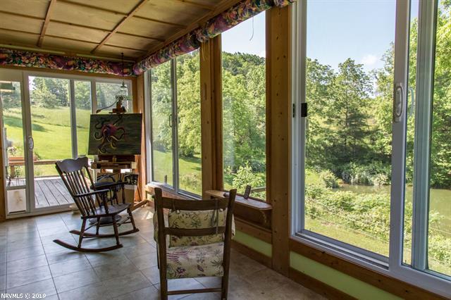 2094 Union School Road Southwest Willis, VA 24380 - Photo 6 of 40 a view of a room with furniture and floor to ceiling window