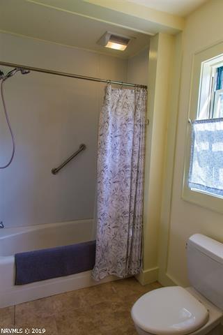 2094 Union School Road Southwest Willis, VA 24380 - Photo 8 of 40 a bathroom with a toilet and a shower