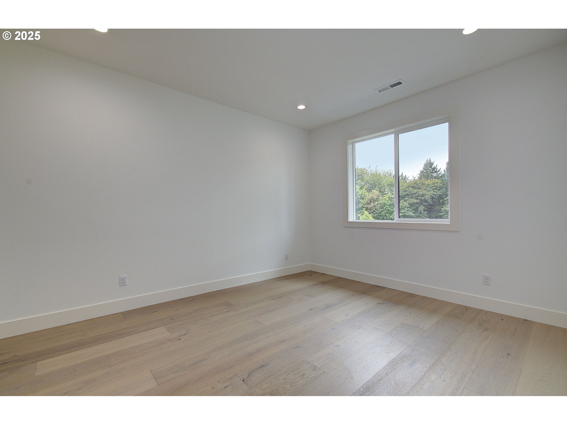 2012 Northeast 159th Street Ridgefield, WA 98642 - Photo 23 of 47 a view of an empty room with wooden floor and a window