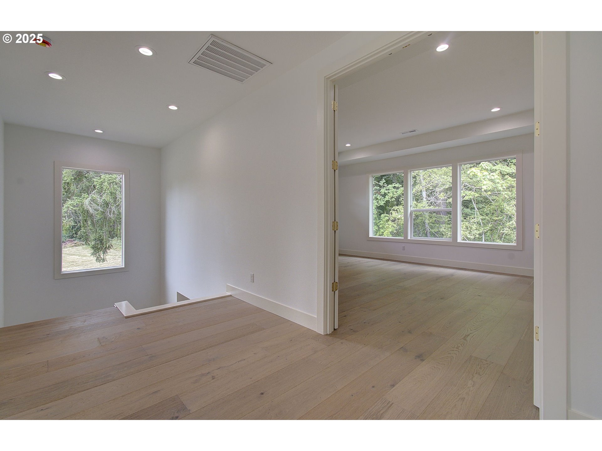 2012 Northeast 159th Street Ridgefield, WA 98642 - Photo 26 of 47 a view of an empty room with wooden floor and a window