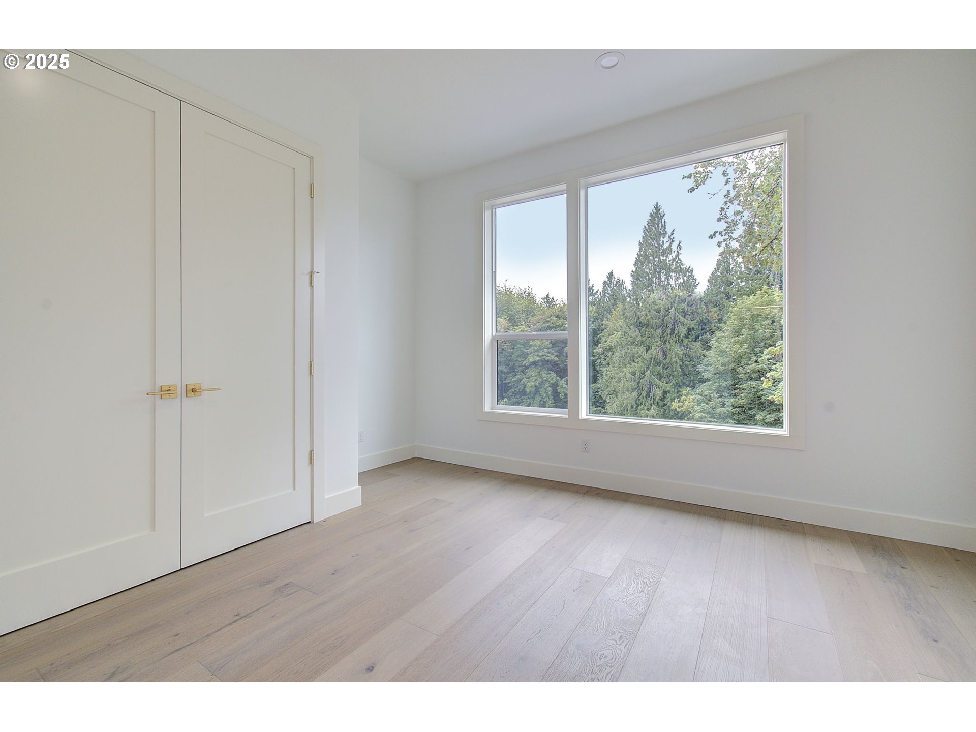 2012 Northeast 159th Street Ridgefield, WA 98642 - Photo 27 of 47 a view of an empty room with wooden floor and a window