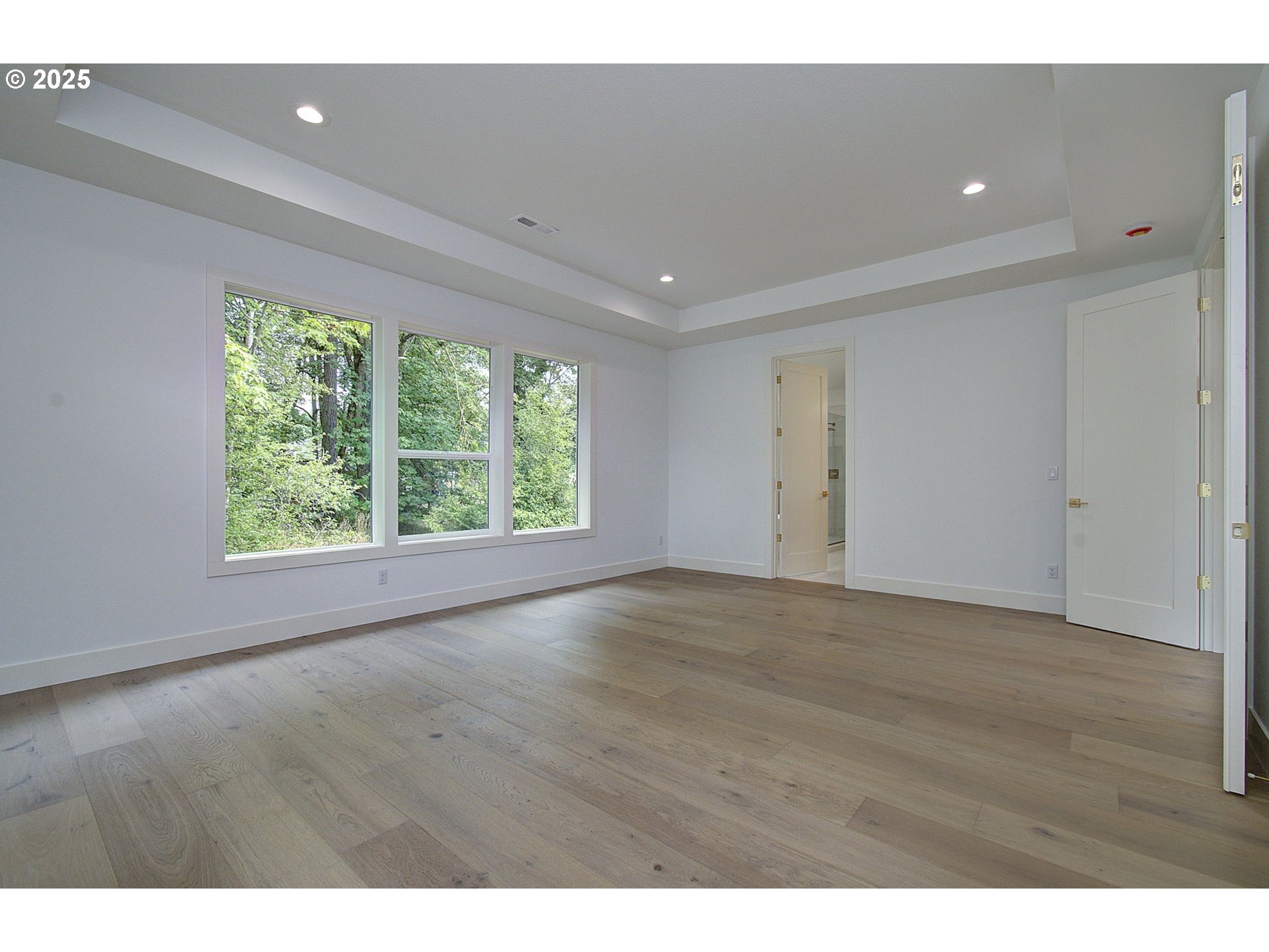 2012 Northeast 159th Street Ridgefield, WA 98642 - Photo 39 of 47 a view of an empty room with wooden floor and a window