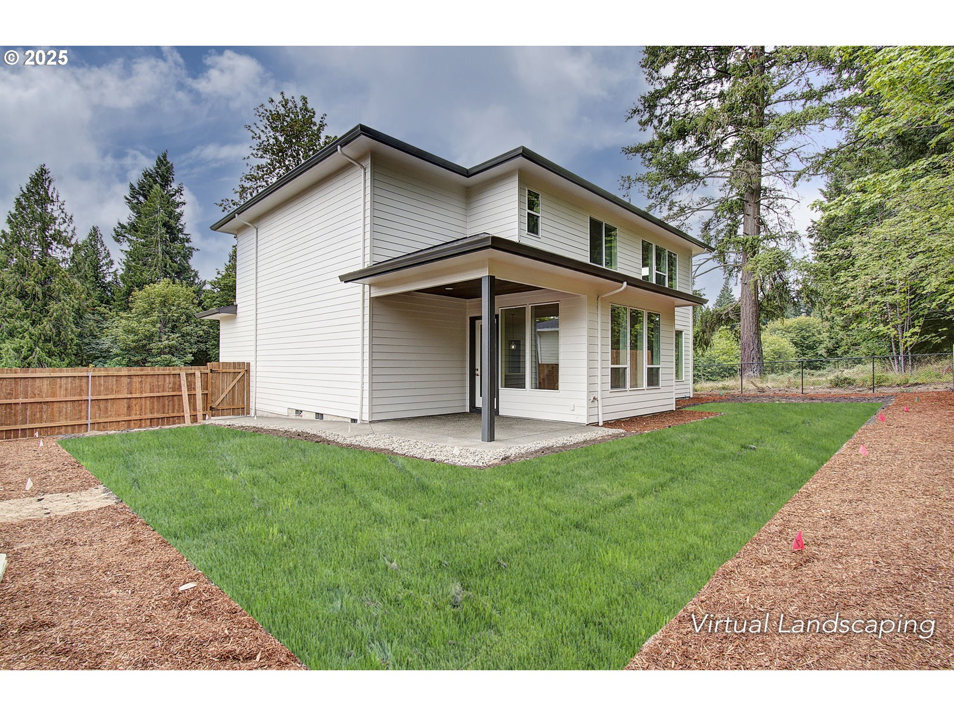 2012 Northeast 159th Street Ridgefield, WA 98642 - Photo 44 of 47 a white house that has a small yard and couches chairs with wooden fence