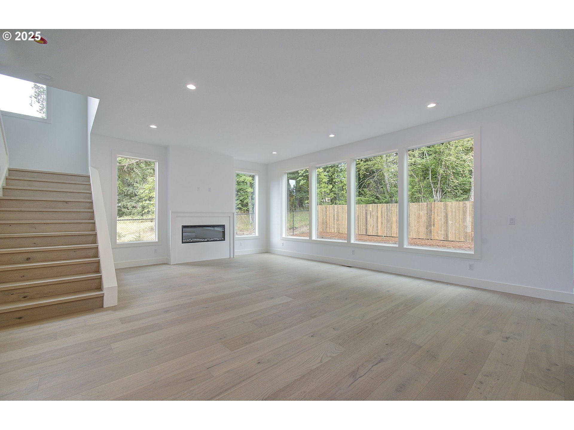 2012 Northeast 159th Street Ridgefield, WA 98642 - Photo 7 of 47 a view of an empty room with a window and a fireplace