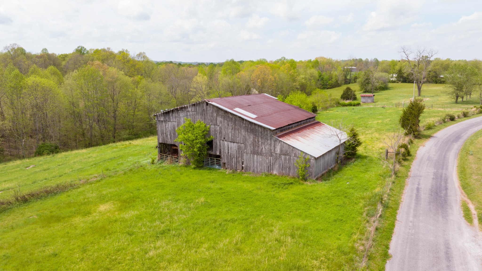 0 Powell Road Red Boiling Springs, TN 37150 - Photo 38 of 69 a view of a big house with a big yard and large trees