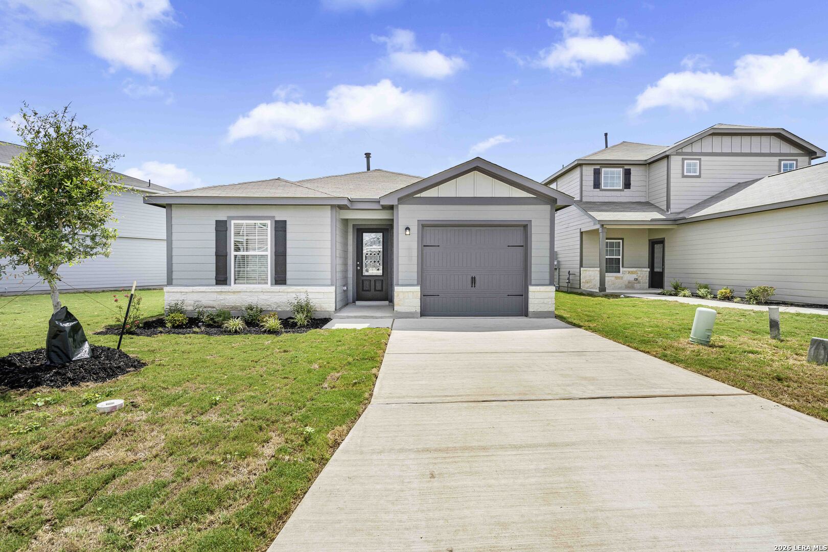 2838 Forsyth Canyon Converse, TX 78109 - Photo 1 of 1 a front view of a house with a garden and yard