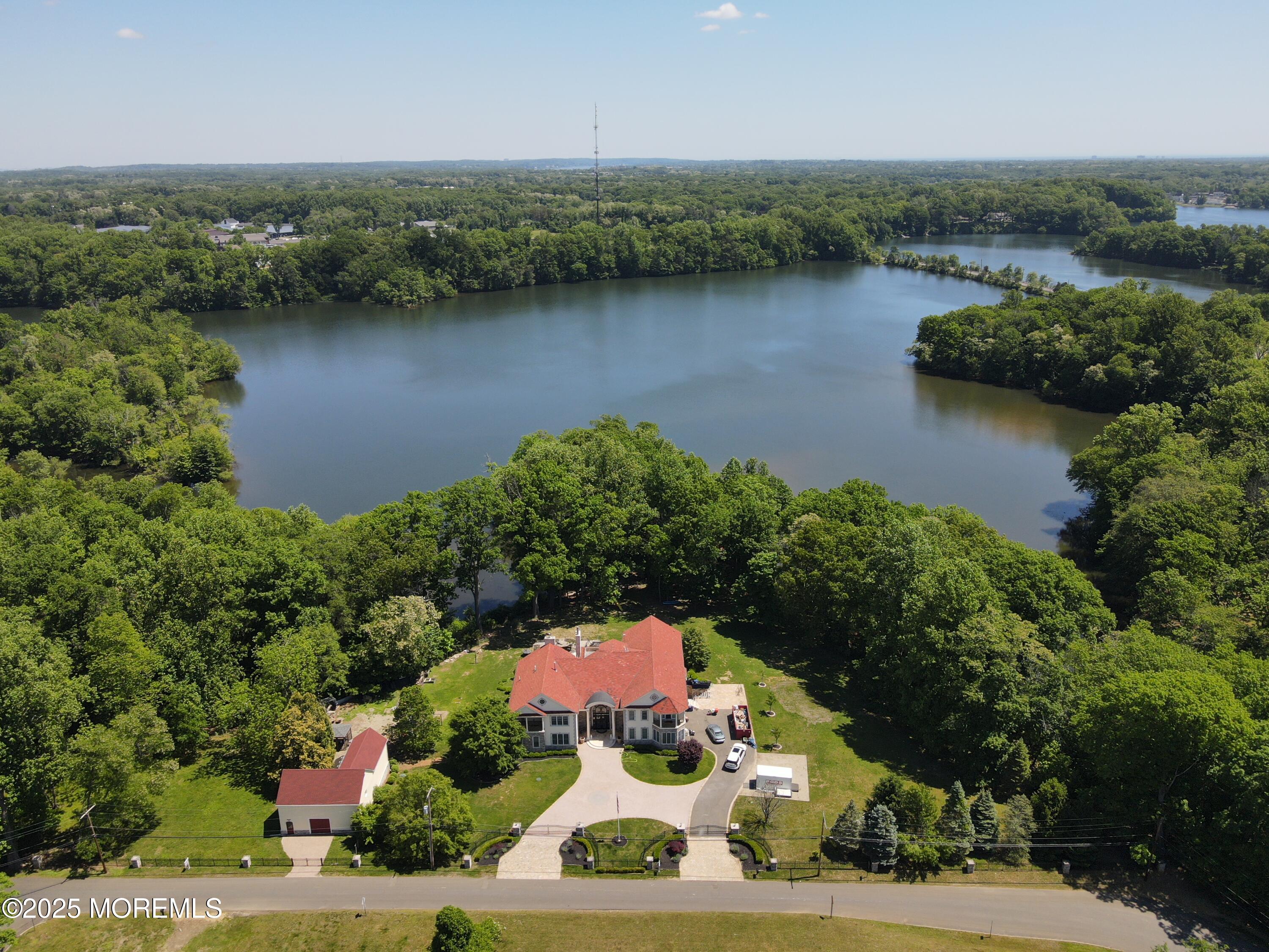 100 Richdale Road Colts Neck, NJ 07722 - Photo 29 of 31 an aerial view of a house with a lake view