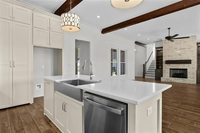 a aerial view of a house next to a big yard