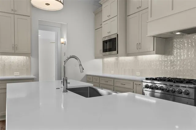 a view of living room with granite countertop furniture and fireplace