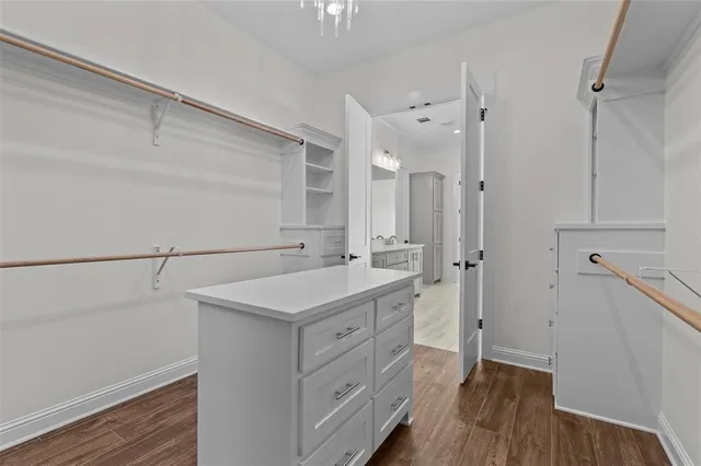 a white bath tub sitting next to a white sink