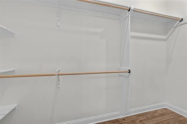 a bathroom with a sink toilet a mirror and shower