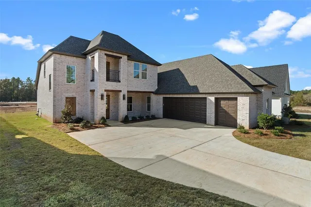 a front view of a house with yard